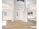 Bright foyer with grand arches, white columns and trim, and light wood floors at 10950 Glenhurst Pass, Duluth, GA 30097