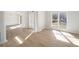 Inviting living room featuring bright white trim and light wood flooring at 10950 Glenhurst Pass, Duluth, GA 30097