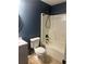 The renovated bathroom includes a vanity, toilet, and shower at 2702 Rambling Way, Lithonia, GA 30058