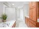 Bright bathroom with a soaking tub, a glass-enclosed shower and ample storage space at 55 Little Barley Ln, Grayson, GA 30017
