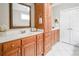 Bathroom showcasing dual sinks, a storage tower, and plenty of natural light at 55 Little Barley Ln, Grayson, GA 30017