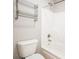 Cozy bathroom features a toilet, towel rack, and a shower-tub combo at 55 Little Barley Ln, Grayson, GA 30017