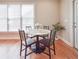 Bright breakfast area with a round table, four chairs, and natural light from a large window at 55 Little Barley Ln, Grayson, GA 30017