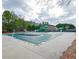 A community pool is covered, featuring a slide and various water activities for residents' enjoyment at 55 Little Barley Ln, Grayson, GA 30017