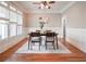 Features a dining table with four chairs, wood flooring, and ample natural light at 55 Little Barley Ln, Grayson, GA 30017