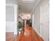 Hallway leading to fireplace with staircase and pot plant at 55 Little Barley Ln, Grayson, GA 30017