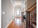 A welcoming foyer featuring hardwood floors and a decorative staircase at 55 Little Barley Ln, Grayson, GA 30017