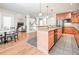 Kitchen showcases wood cabinetry, granite countertops, stainless appliances, and an eat-in breakfast area at 55 Little Barley Ln, Grayson, GA 30017