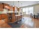 Charming kitchen with wooden cabinets, granite countertops, and a breakfast bar with seating at 55 Little Barley Ln, Grayson, GA 30017