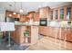 Stylish kitchen with light wood cabinets, a granite countertop island, and modern appliances at 55 Little Barley Ln, Grayson, GA 30017