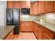 Updated kitchen featuring stainless steel appliances, granite countertops, and wooden cabinets at 55 Little Barley Ln, Grayson, GA 30017