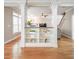 Open living space with built-in shelving, hardwood floors, and view of stairs at 55 Little Barley Ln, Grayson, GA 30017