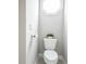 Cozy powder room with white toilet and a small plant for added charm at 55 Little Barley Ln, Grayson, GA 30017