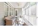 Charming sunroom with comfortable seating and screened windows for enjoying the outdoors at 55 Little Barley Ln, Grayson, GA 30017