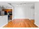 Inviting dining area adjacent to the kitchen, showcasing hardwood floors and comfortable seating at 1075 Peachtree Walk # A-307, Atlanta, GA 30309