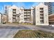 Exterior view of the condo building with multiple floors and balconies at 1075 Peachtree Walk # A-307, Atlanta, GA 30309