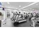 Community gym features modern treadmills, elliptical machines, and mirrored walls for fitness enthusiasts at 1075 Peachtree Walk # A-307, Atlanta, GA 30309