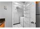 Laundry room with shelves, a washer, and dryer at 1075 Peachtree Walk # A-307, Atlanta, GA 30309