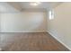 Finished basement area with neutral carpet, recessed lighting, and a window at 3090 Chimney W Rdg, Snellville, GA 30078