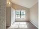 Well-lit bedroom with neutral carpet, closet, and large window at 3090 Chimney W Rdg, Snellville, GA 30078