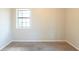 Comfortable bedroom with a window providing natural light and soft carpeting at 3090 Chimney W Rdg, Snellville, GA 30078