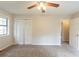 Bright bedroom with a ceiling fan, closet, and a window offering ample natural light at 3090 Chimney W Rdg, Snellville, GA 30078