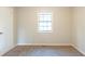 Bedroom with a large window offering natural light and neutral walls, creating a serene atmosphere at 3090 Chimney W Rdg, Snellville, GA 30078