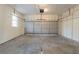 A well-lit garage featuring an automatic door, offering secure parking and additional storage space at 3090 Chimney W Rdg, Snellville, GA 30078