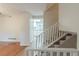 Hallway and staircase with views into the kitchen at 3090 Chimney W Rdg, Snellville, GA 30078