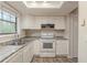 Functional kitchen featuring light-colored countertops and appliances at 3090 Chimney W Rdg, Snellville, GA 30078