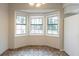 Kitchen dining area with a view of the backyard through three windows at 3090 Chimney W Rdg, Snellville, GA 30078