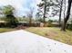 Expansive backyard with a concrete patio and a wood fence at 4206 Sherwood Ave, Decatur, GA 30035