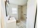 Bathroom featuring a vanity sink and a shower with tiled floors at 4206 Sherwood Ave, Decatur, GA 30035