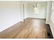 Bright living room featuring hardwood floors, white walls, and natural light from windows at 4206 Sherwood Ave, Decatur, GA 30035