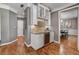 Stylish butler's pantry with granite countertops, glass cabinets, a wine refrigerator, and mosaic tile backsplash at 4580 Windsor Park Place, Atlanta, GA 30342