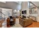 Spacious living room with high ceilings, a fireplace, built-in bookshelves, and hardwood floors at 4580 Windsor Park Place, Atlanta, GA 30342