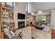 Inviting living room featuring a fireplace, custom built-ins, and a view into the dining area at 4580 Windsor Park Place, Atlanta, GA 30342