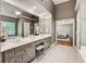 Bright primary bathroom with double sinks, large mirror, and separate tub and shower at 4580 Windsor Park Place, Atlanta, GA 30342