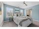 Comfortable bedroom with lots of light from two windows and coastal decor at 923 Buckhorn Bnd, Locust Grove, GA 30248