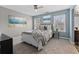 Stylishly decorated bedroom offers lots of natural light and coastal decor at 923 Buckhorn Bnd, Locust Grove, GA 30248