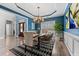 Bright dining room with hardwood floors, stylish chandelier, and large window providing natural light at 923 Buckhorn Bnd, Locust Grove, GA 30248