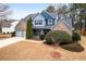 Beautiful two-story home featuring a well-kept lawn, mature trees, and a two-car garage at 923 Buckhorn Bnd, Locust Grove, GA 30248