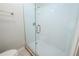 Bathroom features a walk-in shower with glass door and new tile at 1838 Nicole Ln, Lithonia, GA 30058