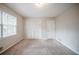 Bedroom with closet with louvered doors and natural light at 1838 Nicole Ln, Lithonia, GA 30058