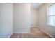 Bedroom featuring neutral colored walls, soft carpet, and natural light from the window at 1838 Nicole Ln, Lithonia, GA 30058