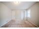Bedroom with natural light and closet with louvered doors and a door leading outside at 1838 Nicole Ln, Lithonia, GA 30058