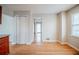 Open dining area with wood floors next to the kitchen, lots of light from two windows at 1838 Nicole Ln, Lithonia, GA 30058