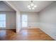 Dining area boasts hardwood floors and a stylish chandelier at 1838 Nicole Ln, Lithonia, GA 30058
