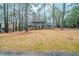 Charming two-story home with traditional design and mature trees in a landscaped yard at 1838 Nicole Ln, Lithonia, GA 30058