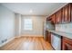 Bright kitchen featuring stainless steel appliances, granite countertops, and wooden floors at 1838 Nicole Ln, Lithonia, GA 30058